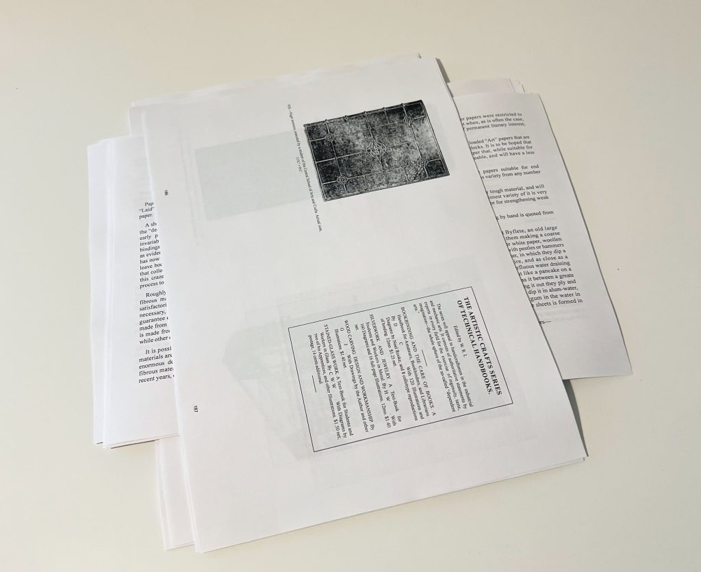 A pile of signatures, printed and ready to be folded.